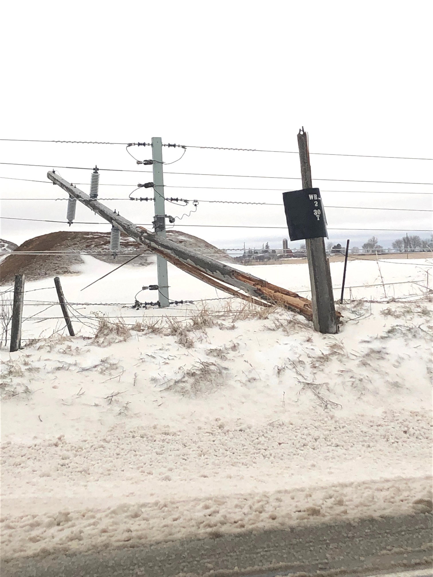 photo showing broken electric pole
