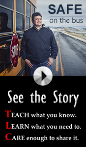 man standing in front of school bus