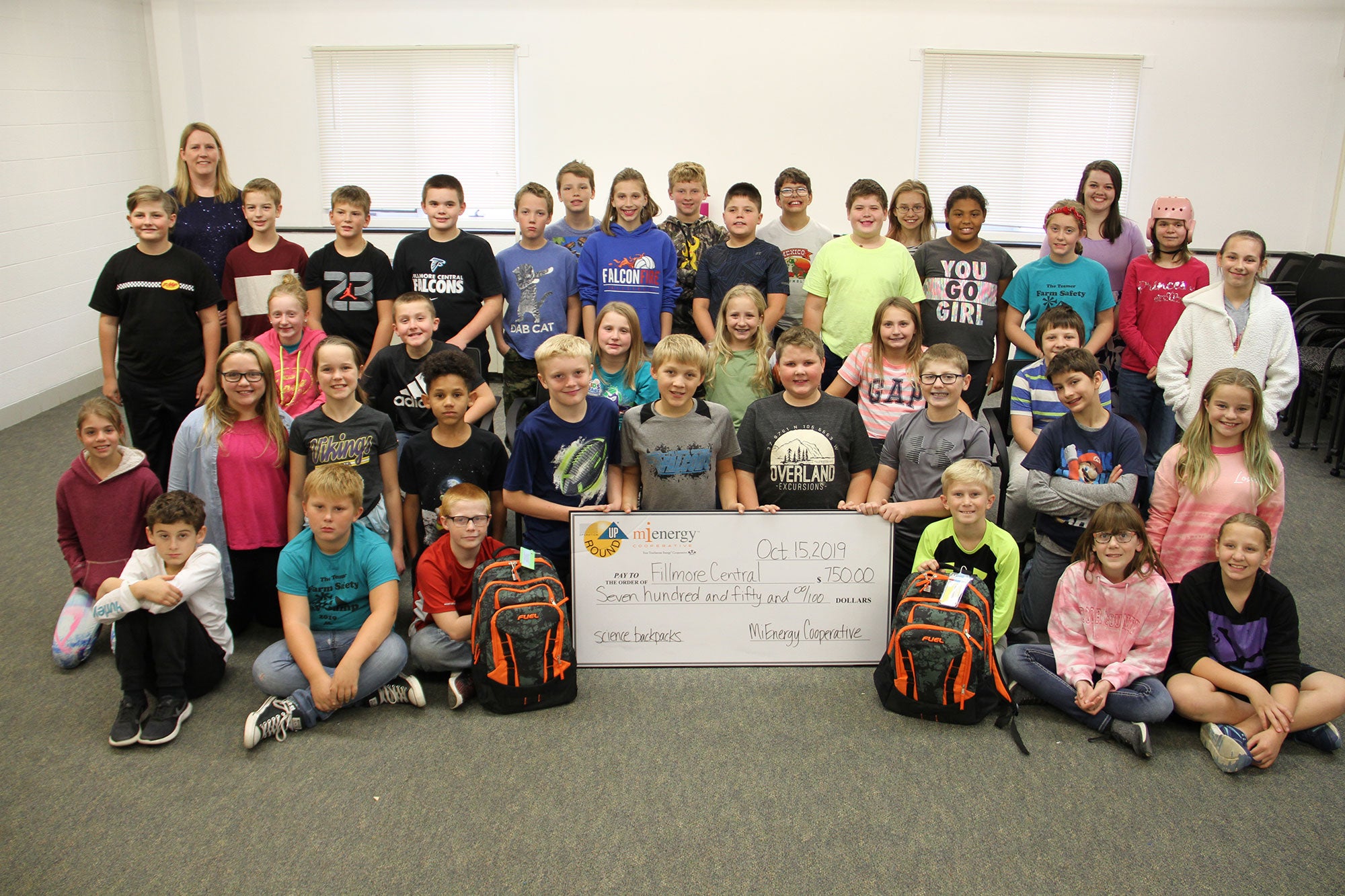 children gathered around a large check